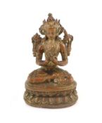 A Tibetan gilt copper alloy figure of Maitreya, 17th/18th century,seated in dhyanasana on a double-