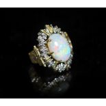 A 1970's? textured two colour 18ct gold and white opal set oval dress ring,the shank indistinctly