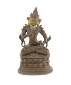 A Himalayan bronze seated figure of Vajrasattva, 18th/19th century,seated in dhyanasana on a