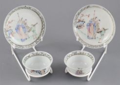 A pair of Chinese famille rose 'sages' tea bowls and saucers, Qianlong period,each painted with two