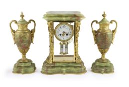 A green onyx and gilt metal clock garniture, comprising a four-glass regulator with enamelled dial