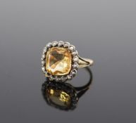 A 19th century gold, citrine and seed pearl set shaped square cluster ring,size M, gross weight 4.7