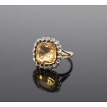 A 19th century gold, citrine and seed pearl set shaped square cluster ring,size M, gross weight 4.7