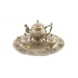 An impressive Burmese Sterling silver (950) three-piece tea service, with tray, cast with figures,