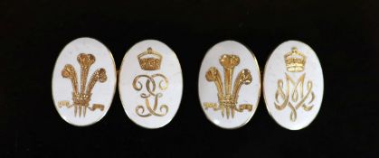 A pair of gold and white enamel oval cufflinks, each gilded with Prince of Wales Feathers and