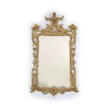 A George III Chippendale style giltwood wall mirrorwith shaped rectangular frame carved and pierced