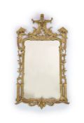 A George III Chippendale style giltwood wall mirrorwith shaped rectangular frame carved and pierced