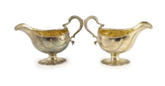 A pair of early George III silver oval pedestal sauce boats by Whyte & Holmes?,with gadrooned