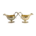 A pair of early George III silver oval pedestal sauce boats by Whyte & Holmes?,with gadrooned