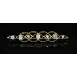 A gold and seven stone graduated rose and old mine cut diamond set bar brooch,67mm, gross 6.8