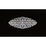 A Belle Epoque gold and platinum, diamond and shaped cut sapphire millegrain set brooch,of pierced