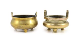 Two Chinese bronze tripod censers, 18th and 19th century,the first with a pair of high looped