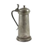 An early 17th century pewter flagon of tall cylindrical form, maker's mark 'BB'H 37cm.