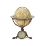 A George III terrestrial table globe by Dudley Adams of Charing Cross, Londonon original mahogany