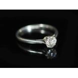 A platinum and diamond solitaire ring, the claw-set circular brilliant cut diamond approximately 0.