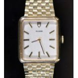 A lady's 1980's 9ct gold Tudor manual wind rectangular dial wrist watch, on an integral 9ct gold