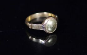 An antique gold ring, the centre now with gold? (ex gemstone) insert,size S/T, gross 7 grams.