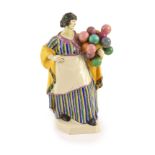 A Charles Vyse pottery figure The Balloon Seller, c.1922,inscribed in blue ‘Chelsea 1922 CV’,22.5