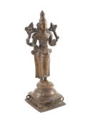 A tall Indian bronze figure of the Hindu deity Shiva Chandrashekhara, 18th/19th century,on a square
