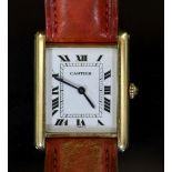 A lady's 18ct gold Cartier Tank Louis quartz wrist watch, on a leather strap,with rectangular Roman