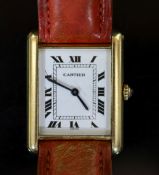 A lady's 18ct gold Cartier Tank Louis quartz wrist watch, on a leather strap,with rectangular Roman