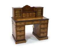 An Edwards & Roberts inlaid burr walnut pedestal desk,the raised superstructure with four central