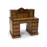An Edwards & Roberts inlaid burr walnut pedestal desk,the raised superstructure with four central