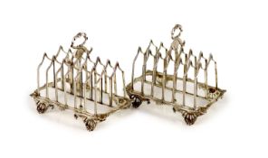 A pair of William IV silver gothic style seven bar toastracks, by Charles Fox II,with ring handles