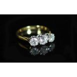 A 18ct gold and platinum, three stone diamond ring,with a total approximately estimated diamond
