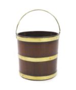 A George III mahogany peat bucket,of brass bound staved construction,W.31cm H.29cm