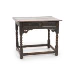 A Charles II oak side tablewith moulded rectangular top and panelled freize drawer, on Bobbin