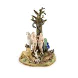 A Meissen figural group of the Garden of Eden, 19th century,modelled with Adam and Eve standing