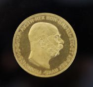 An Austrian 100 Corona 1915 gold coin, Franz Joseph I bare head to obverse, Arms of Austria to