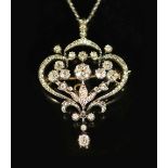 A 19th century gold, silver and diamond set open work scroll drop pendant brooch, together with a