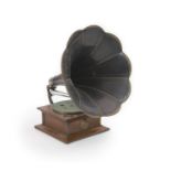 An Edwardian oak cased Columbia gramophonestamped PAT Aug 13, 1901. with a group of 78 rpm records