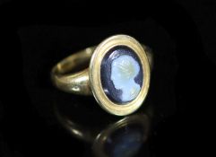 An antique gold and sardonyx cameo ring,carved with the bust of a lady to dexter, size I, gross