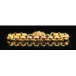 A 19th century star engraved belcher link bracelet, with pierced cannettile work, barrel shaped