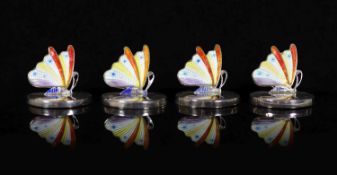 A cased set of four George V novelty silver and enamel oval menu holders, modelled as butterflies,