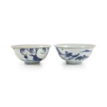 A pair of Chinese Ming blue and white bowls, Wanli period,each painted with continuous landscapes,