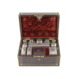 A good late William IV brass inlaid two handled coromandel wood travelling toilet set, containing