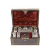 A good late William IV brass inlaid two handled coromandel wood travelling toilet set, containing