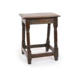 A mid-17th century oak joint stoolwith moulded seat, carved freeze and ring turned legsH 58cm. W