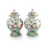 A pair of large Chinese famille verte jars and covers, late 19th century,painted with pheasants