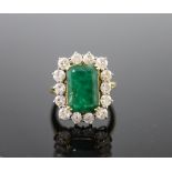 A mid to late 20th century 18ct gold, emerald and diamond set shaped rectangular cluster ring,size