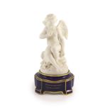 A Sevres biscuit porcelain figure of a cherub, c.1882-4,on a bleu royale plinth inscribed in gilt ‘