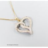 A modern 375 and diamond chip set openwork heart pendant, 22m, on a 9ct gold fine link chain, 46cm,