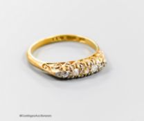 A late 19th/early 20th century 18ct and graduated five stone old cut diamond set half hoop ring,