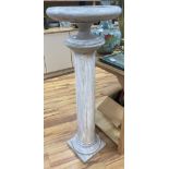 A white marble tazza on associated column stand120cm high (combined) 43cm diameter (tazza)