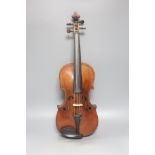 A cased violin and bow