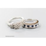A modern 9ct white gold and triple diamond cluster set dress ring, size I/J and a similar sapphire